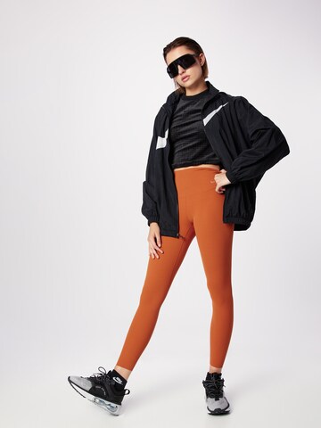 Nike Sportswear Prehodna jakna 'Essential' | črna barva