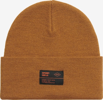 Bonnet 'SURPLUS' Superdry en beige : devant