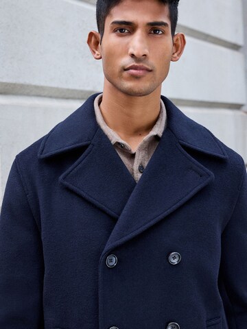 Next Övergångskappa i blå