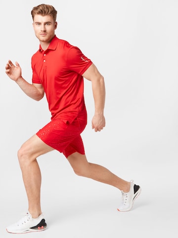 UNDER ARMOURregular Sportske hlače - crvena boja