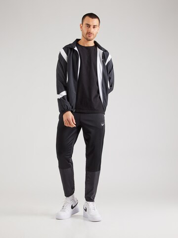 NIKE - Tapered Pantalón deportivo 'Sphere Challenger' en negro