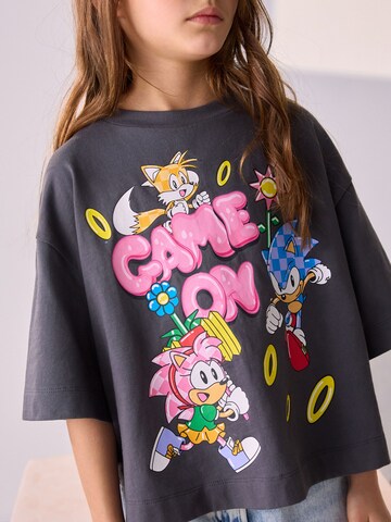 T-Shirt Next en gris