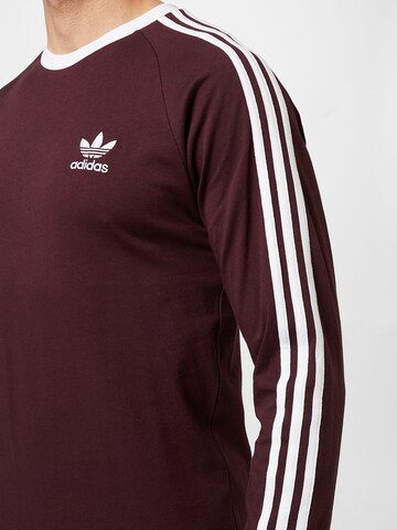 ADIDAS ORIGINALS - Camiseta 'Adicolor Classics 3-Stripes Te' en rojo