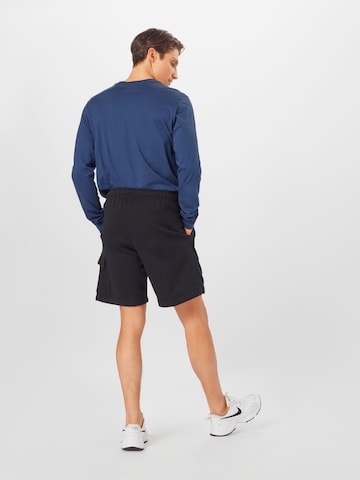 Loosefit Pantaloni cu buzunare de la Nike Sportswear pe negru
