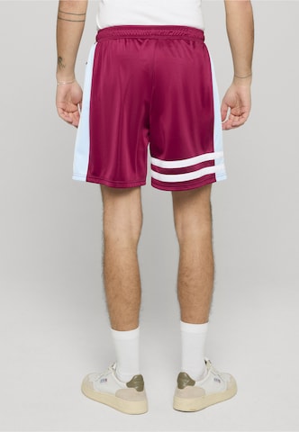 Loosefit Pantaloni 'DMWU' di Unfair Athletics in rosso