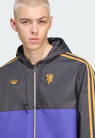 Giacca di mezza stagione 'Manchester United Terrace Icons' di ADIDAS ORIGINALS in nero