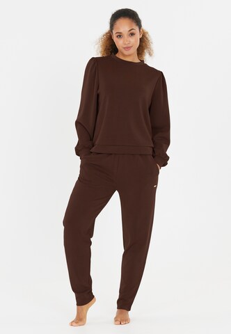 Athlecia Tapered Sports trousers 'Jillnana' in Brown