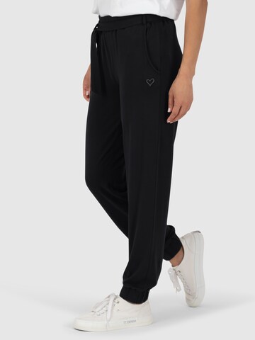 Tapered Pantaloni 'Alice' di Alife and Kickin in nero