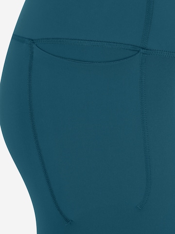 UNDER ARMOUR Skinny Sportbroek 'Meridian' in Groen