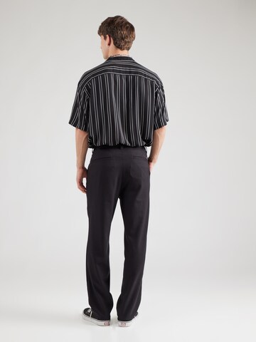 regular Pantaloni con pieghe di Pegador in nero