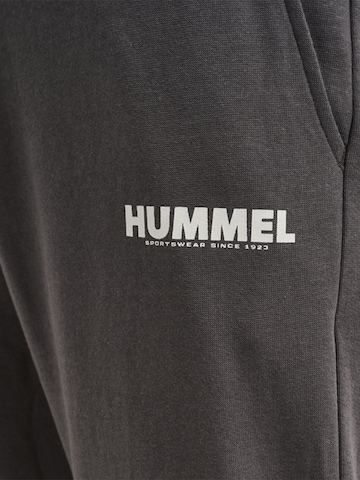 Effilé Pantalon de sport Hummel en noir