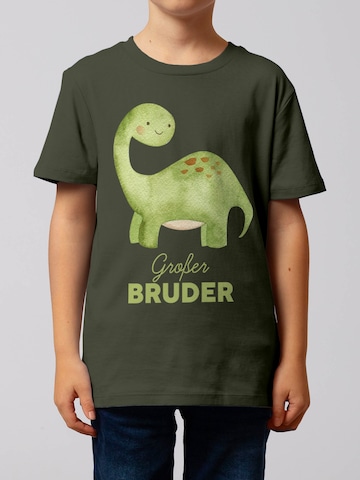 Maglietta 'Dinosaurier 04 Großer Bruder' di watabout.kids in verde: frontale
