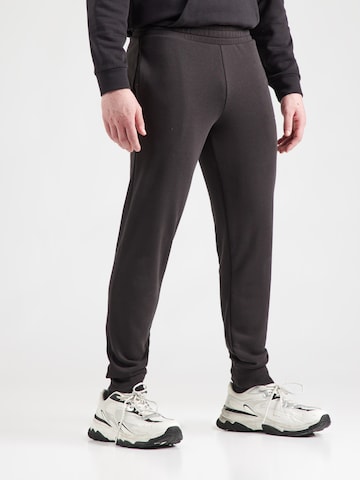 PUMA Конический (Tapered) Спортивные штаны 'Ess No. 1' в Черный: спереди