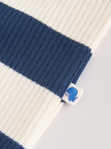 Pijamale de la Next pe bej