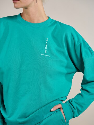 ABOUT YOU x Laura Giurcanu Sweatshirt 'Luca' in Green