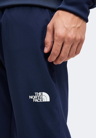 THE NORTH FACE Slimfit Športne hlače 'MOUNTAIN ATHLETICS USHBA' | modra barva