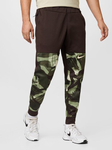 NIKE Tapered Workout Pants in Green: front