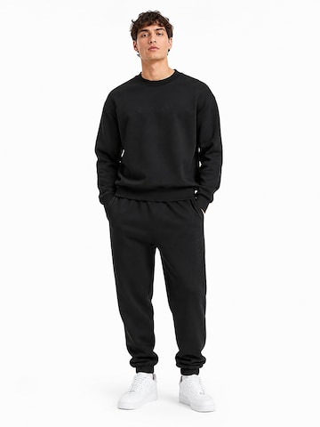 Calvin Klein Regular Sports trousers in Black: front