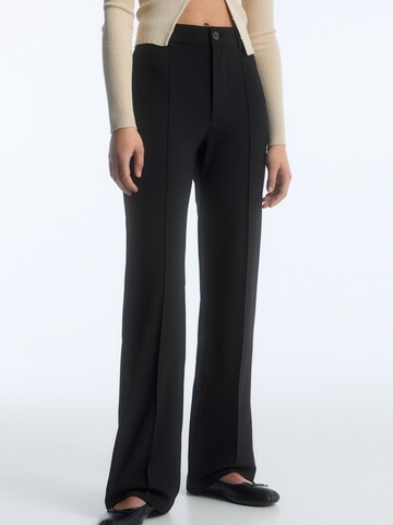 Pull&Bear Regular Trousers with creases in Black: front