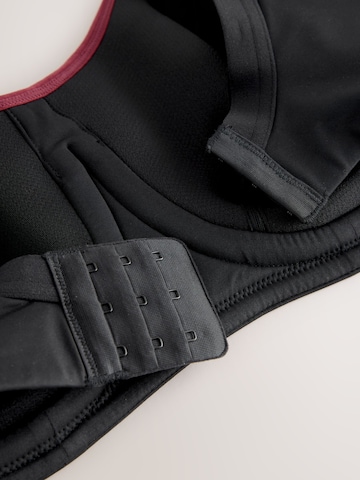 Next Bustier Urheilurintaliivit värissä musta