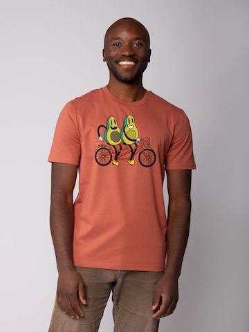 Watapparel T-Shirt 'Avocado Fahrrad' in Braun: Vorderseite