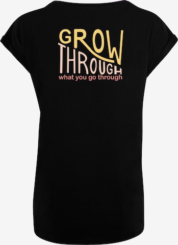 Merchcode T-Shirt  'Spring - Grow Through' in Schwarz