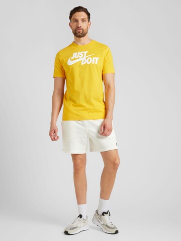 Nike Sportswear Loose fit Trousers 'CLUB' in Beige
