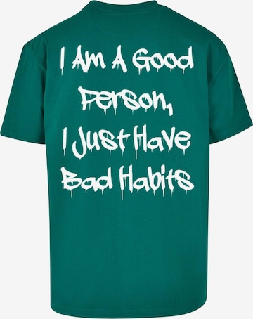 Merchcode T-Shirt 'Bad Habits' in Grün
