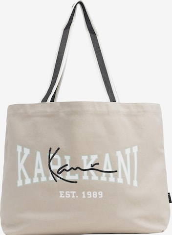 Plase de cumpărături de la Karl Kani pe bej: față