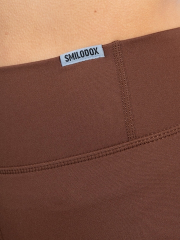 Smilodox Skinny Sporthose 'Advance Pro' in Braun