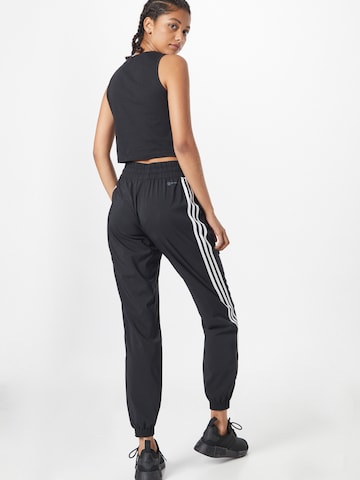 ADIDAS SPORTSWEAR Tapered Παντελόνι φόρμας σε μαύρο