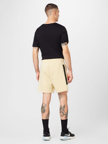 Loosefit Pantalon Nike Sportswear en jaune