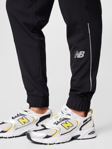 new balance Ozke Športne hlače 'Impact Run' | črna barva