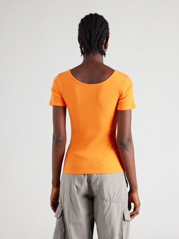 PIECES - Camiseta 'KITTE' en naranja