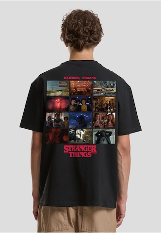 Merchcode Tričko 'Stranger Things Rewatch' – černá: přední strana