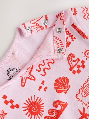 Next - Mono en rosa