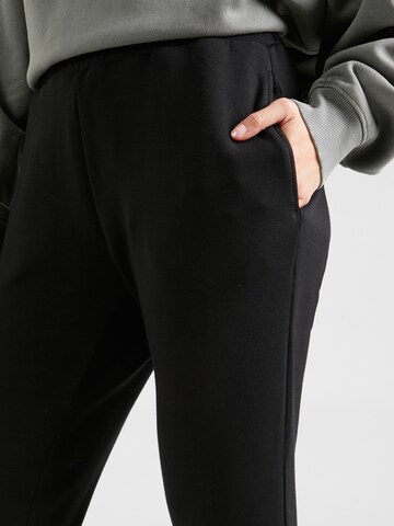 Effilé Pantalon de sport Varley en noir