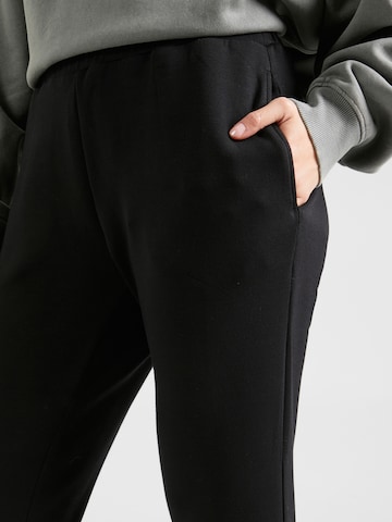 Varley Tapered Sporthose in Schwarz