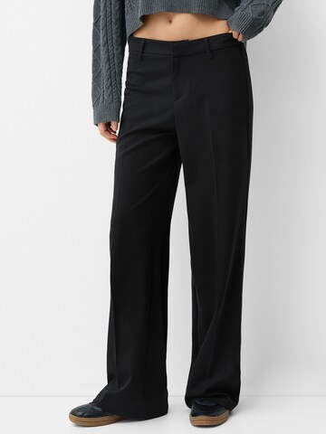 Bershka Wide leg Trousers with creases in Black: front