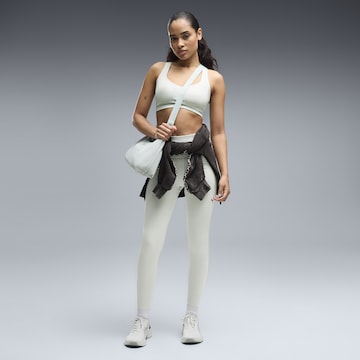 PUMA Skinny Sportbroek in Groen