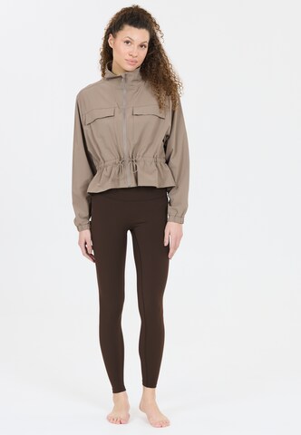 Athlecia Skinny Sports trousers 'Luxe' in Brown