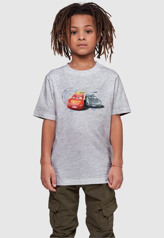 ABSOLUTE CULT T-Shirt 'Cars - Lightning Vs Storm' in Grau: predná strana