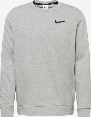 NIKE - Camiseta deportiva en gris: frente