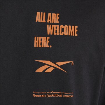 Reebok Shirt 'All Are Welcome Here' in Schwarz