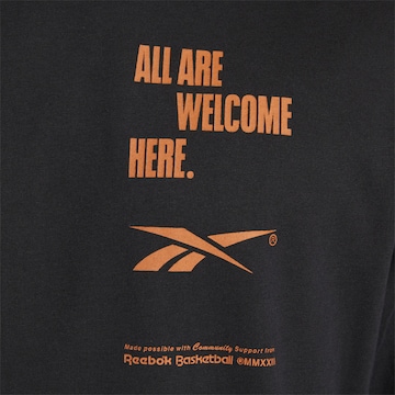 Reebok Shirt 'All Are Welcome Here' in Schwarz