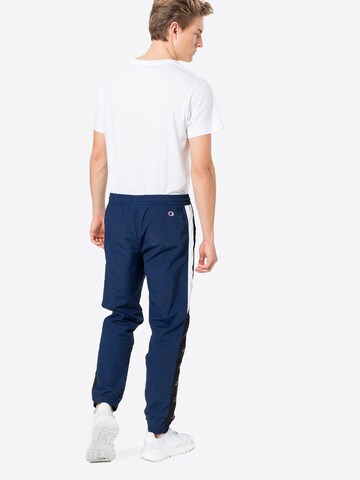 Effilé Pantalon de sport Champion Authentic Athletic Apparel en bleu