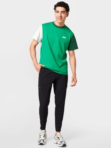 Tapered Pantaloni sport de la Lacoste Sport pe negru