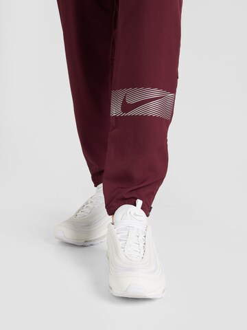 NIKE Tapered Workout Pants 'FLSH CHLLGR' in Red