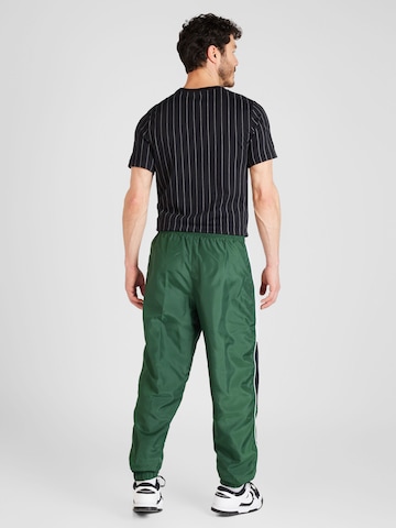 Nike Sportswear Alt kitsenev Püksid 'Air', värv roheline