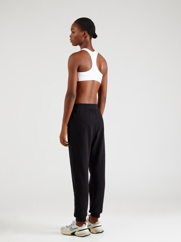 Champion Authentic Athletic Apparel - Tapered Pantalón en negro